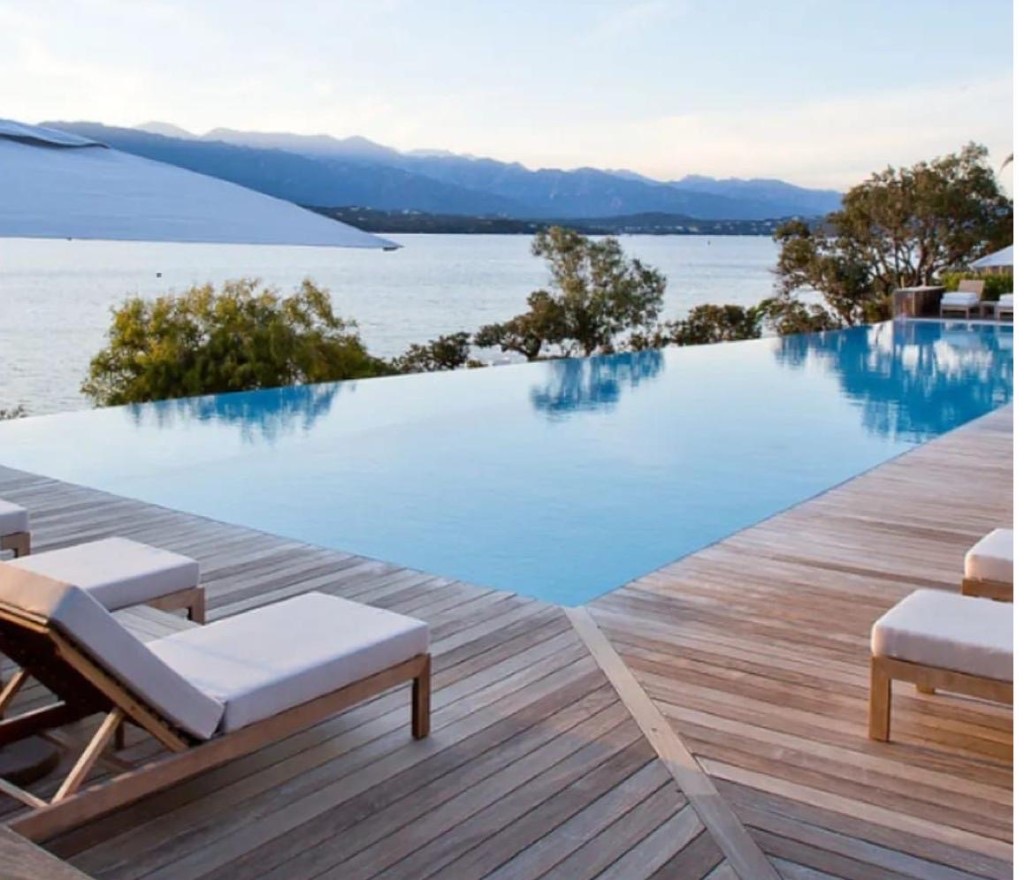Infinity pool and villa terrace overlooking the water